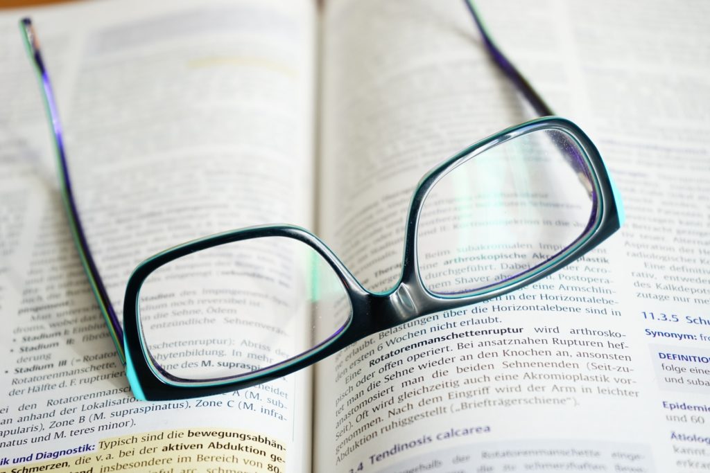 reading glasses on open book
